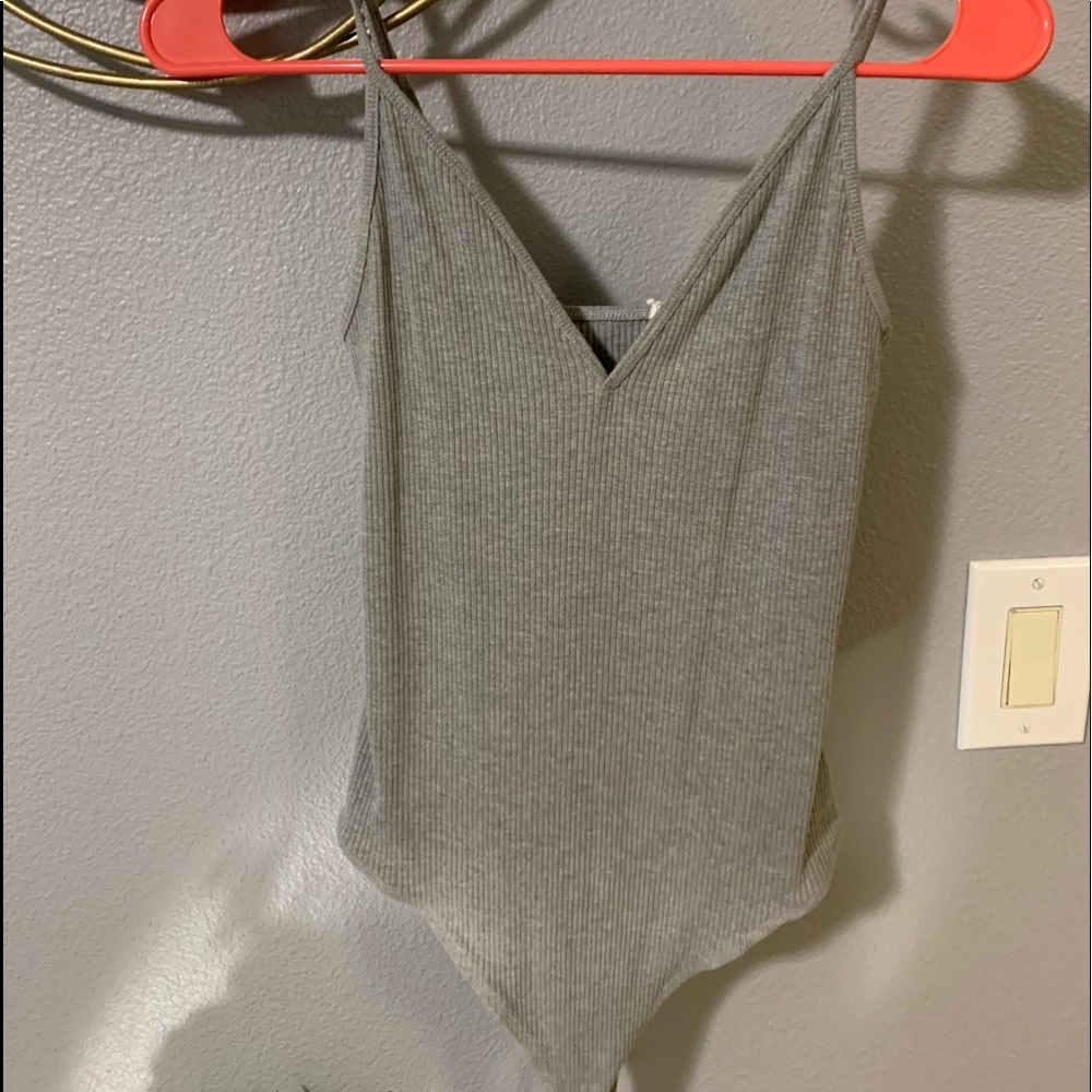 Gray body suit.